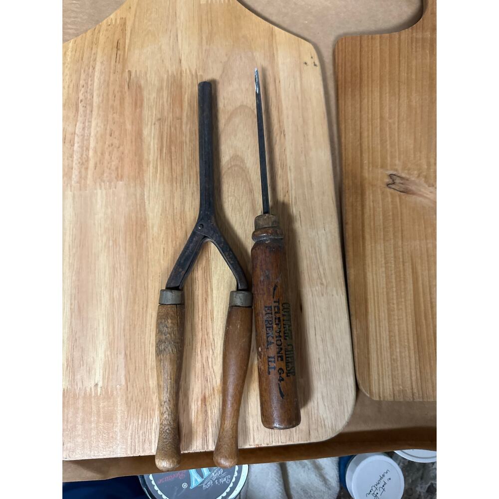 Antique curling iron and advertisement ice pick